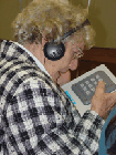 Senior lady using accessible voting machine
